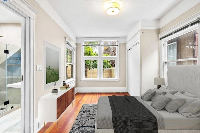 bedroom featuring a closet and light hardwood / wood-style floors