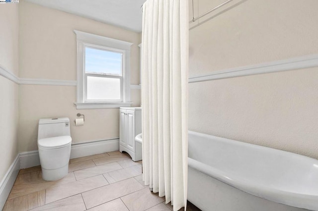 bathroom with tile patterned flooring, toilet, and shower / tub combo