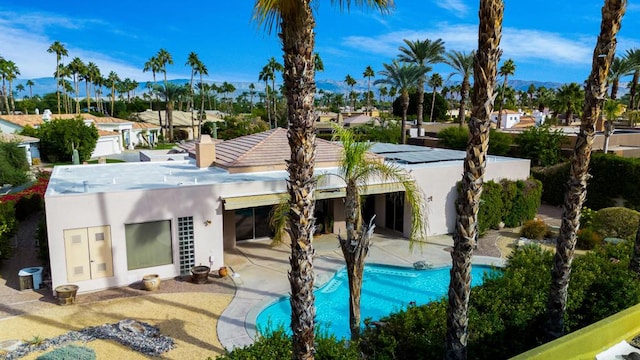 rear view of property featuring a patio