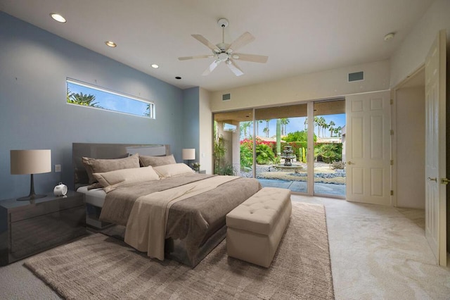 bedroom featuring access to exterior, light colored carpet, multiple windows, and ceiling fan