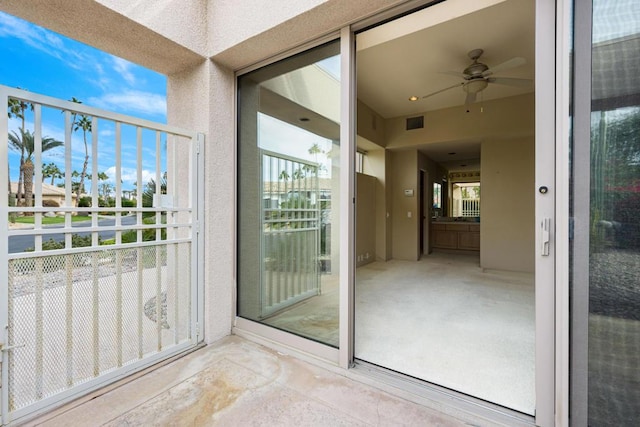 exterior space featuring ceiling fan