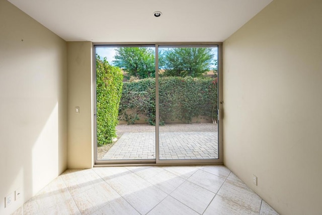 interior space with floor to ceiling windows and a wealth of natural light