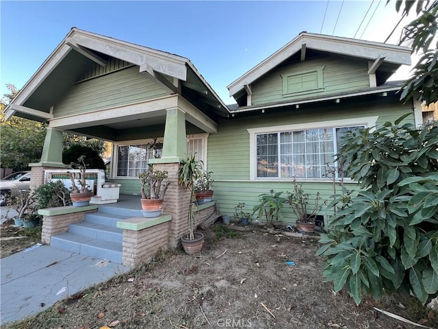 view of front of property featuring covered porch