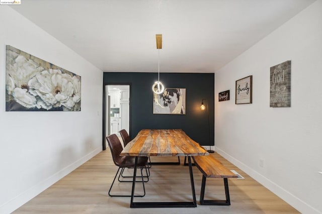 dining area featuring light wood-type flooring