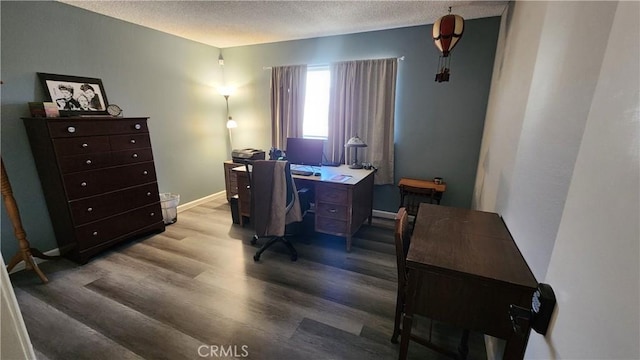 office with hardwood / wood-style floors and a textured ceiling