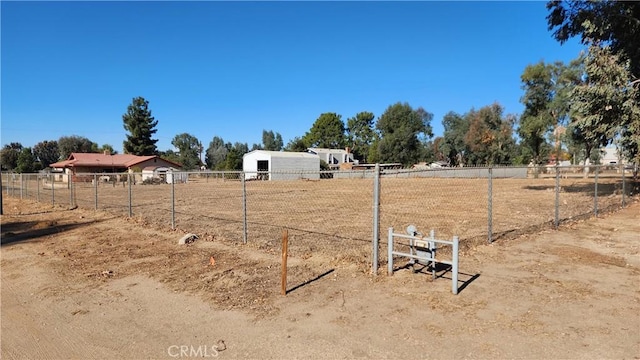 view of yard with a rural view