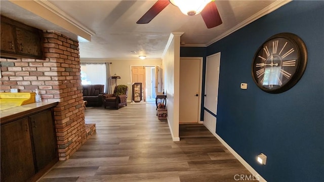 corridor with hardwood / wood-style flooring and crown molding