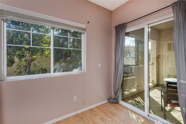 unfurnished room featuring light hardwood / wood-style flooring