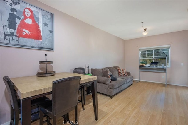 dining room with light hardwood / wood-style flooring