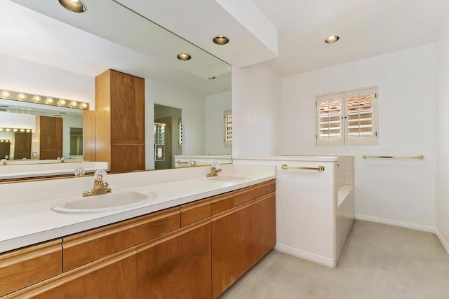 bathroom featuring vanity and a tub