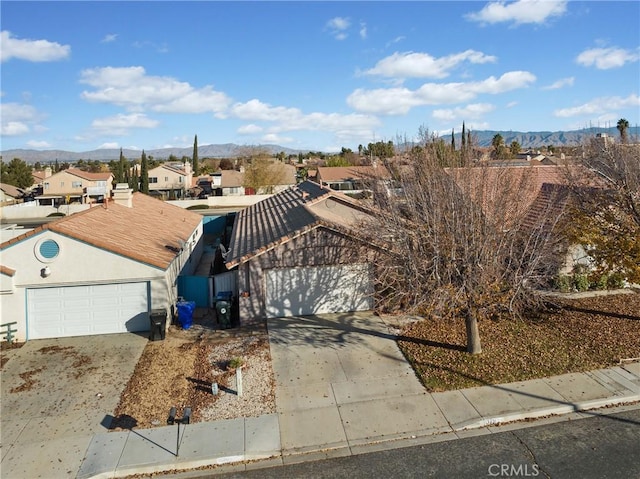 birds eye view of property with a mountain view