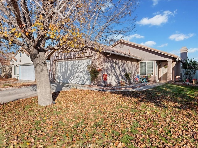 single story home with a garage