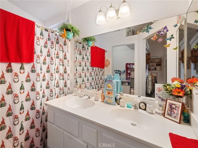 bathroom featuring a shower with shower curtain and vanity