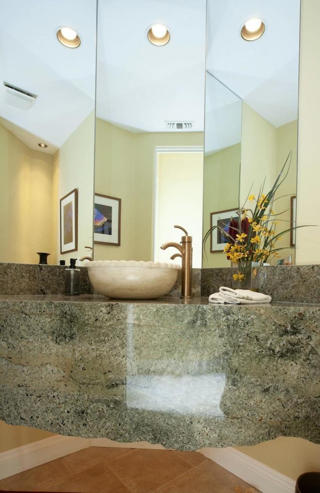 bathroom with tile patterned floors and vanity