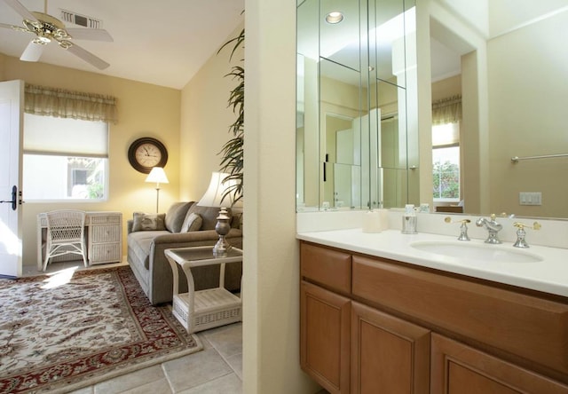 bathroom with tile patterned floors, ceiling fan, a healthy amount of sunlight, and vanity