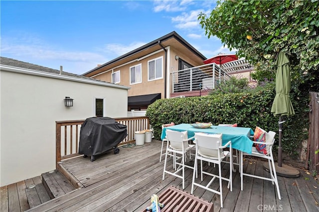 wooden deck with area for grilling