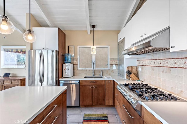 kitchen with sink, white cabinets, pendant lighting, and appliances with stainless steel finishes