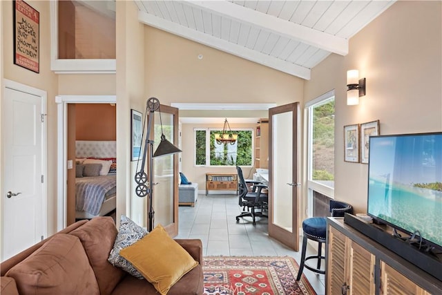 living room featuring wooden ceiling, lofted ceiling with beams, light tile patterned floors, and french doors