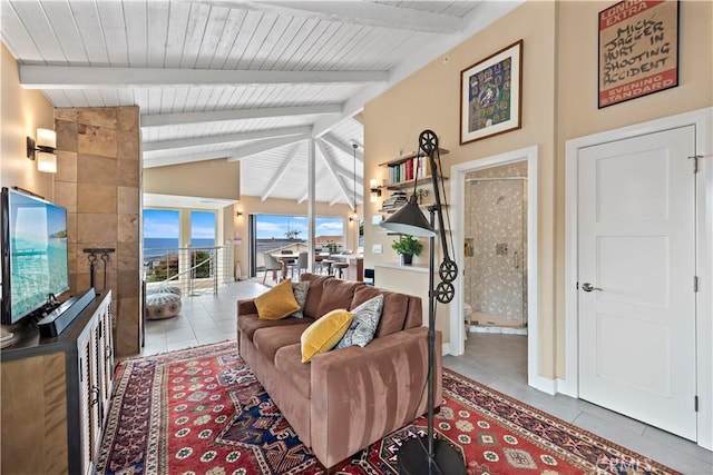 tiled living room featuring vaulted ceiling with beams