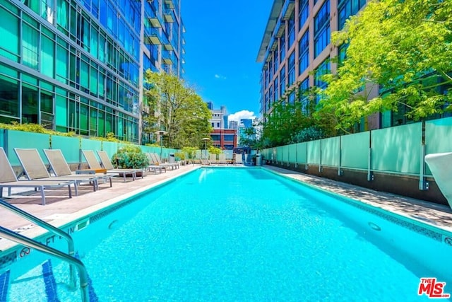 view of swimming pool with a patio area