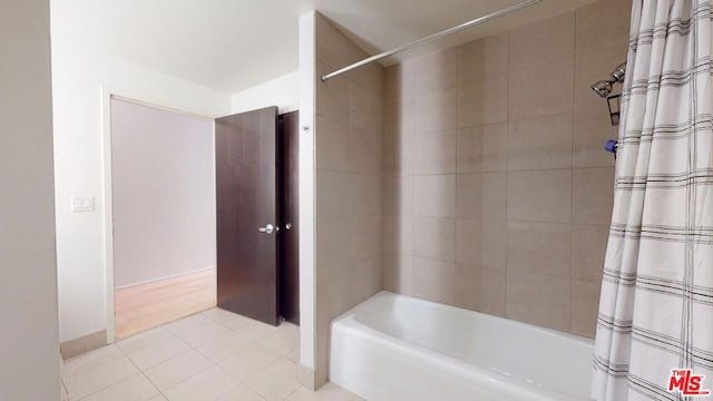 bathroom with shower / tub combo and tile patterned floors