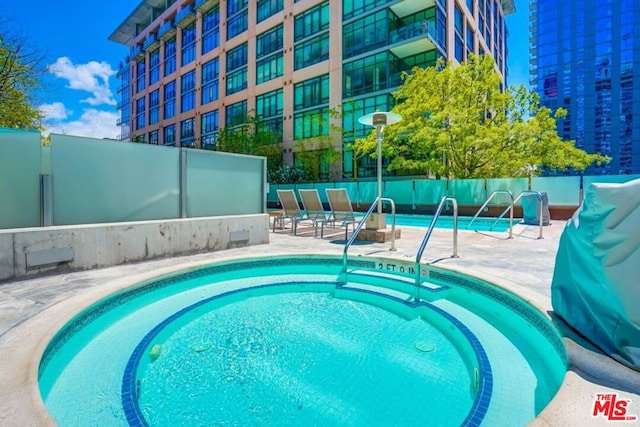 view of swimming pool with a patio area