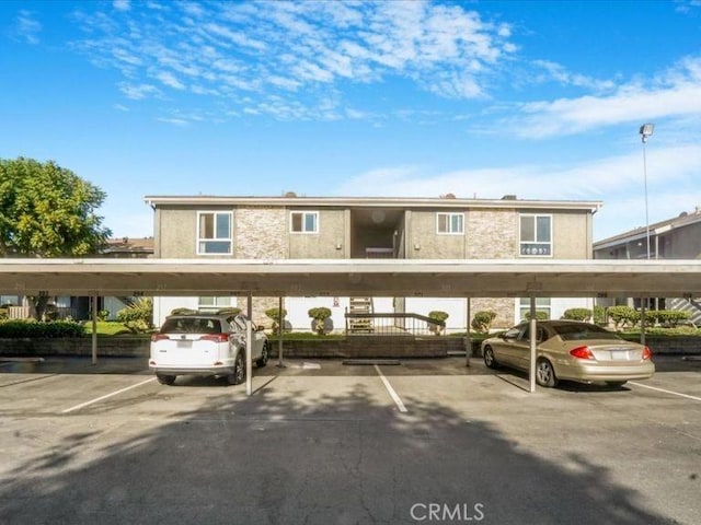 view of parking / parking lot with a carport