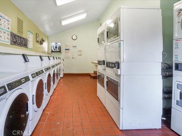 washroom featuring tile patterned floors, washing machine and dryer, and stacked washer / dryer