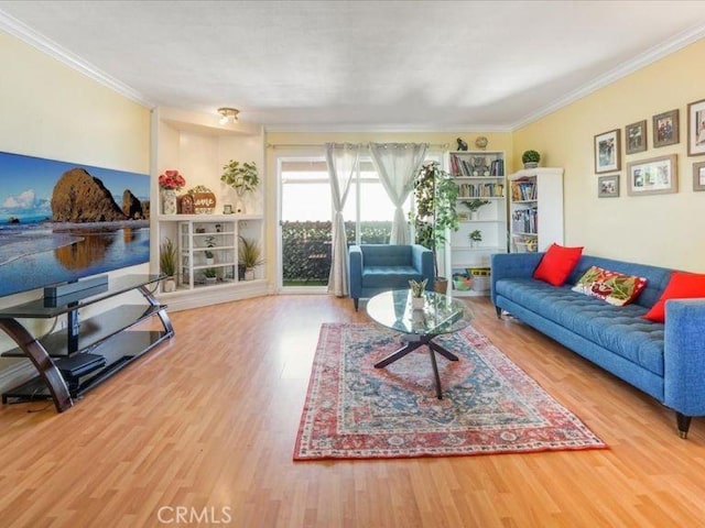 living room with crown molding and wood-type flooring