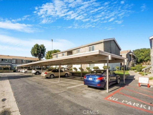 view of parking / parking lot with a carport