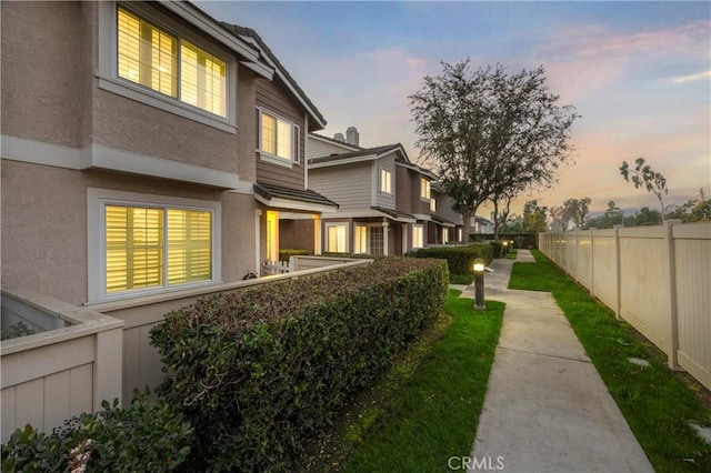 view of property exterior at dusk