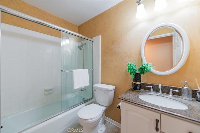 full bathroom with tile patterned flooring, vanity, toilet, and bath / shower combo with glass door