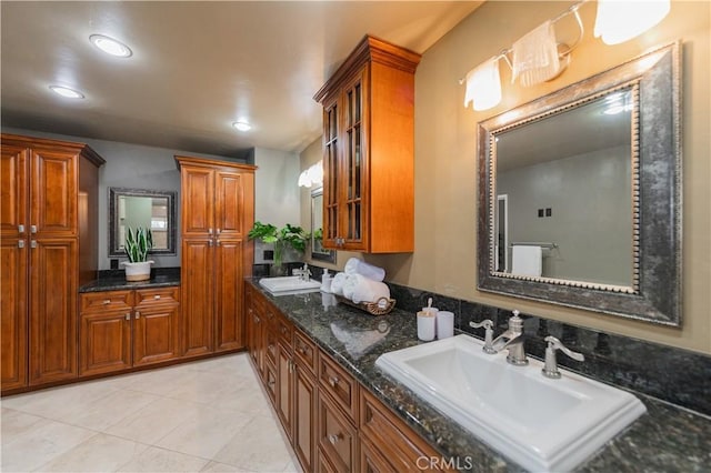 bathroom with tile patterned flooring and vanity