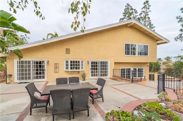 back of property featuring a patio area