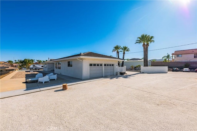 view of side of property with a garage