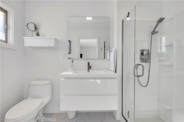 bathroom featuring toilet, vanity, and an enclosed shower