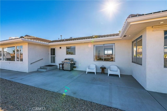 rear view of house featuring a patio area