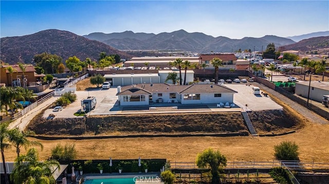 birds eye view of property featuring a mountain view