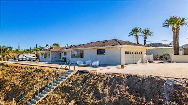 ranch-style house featuring a garage