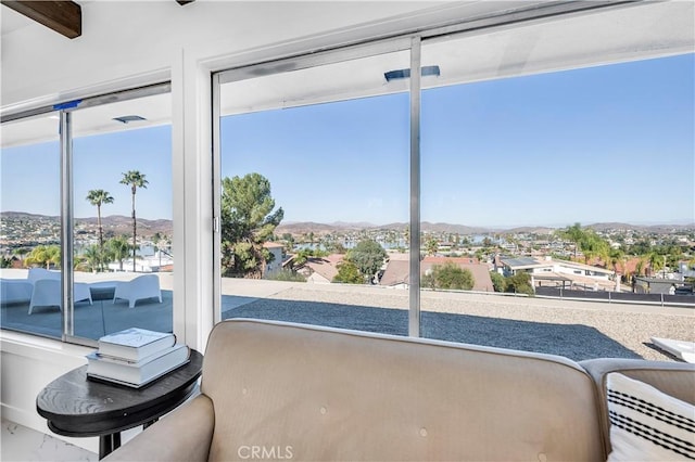 entryway with a wealth of natural light and a mountain view