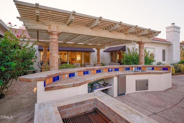 view of patio featuring a pergola