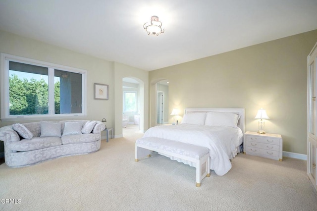 bedroom with light colored carpet