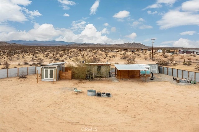 exterior space featuring a mountain view and an outbuilding