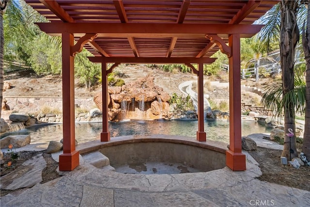 view of patio with a hot tub