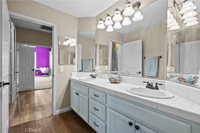 bathroom featuring hardwood / wood-style floors and vanity