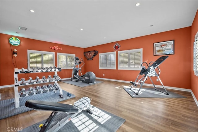 workout area featuring hardwood / wood-style flooring