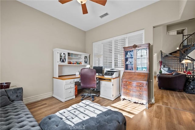 office space featuring ceiling fan and light wood-type flooring