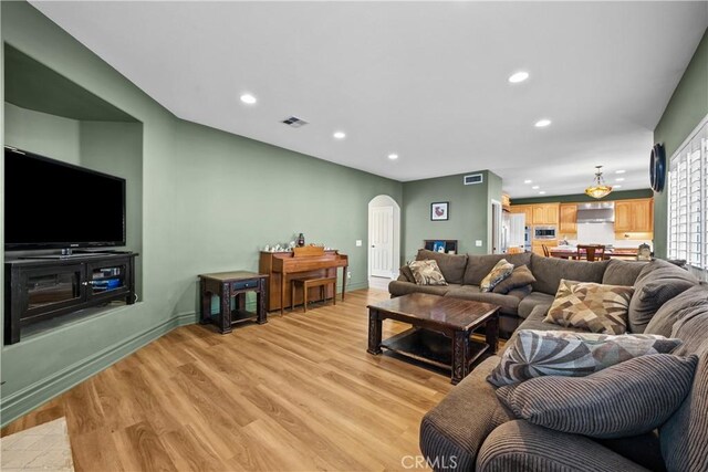 living room with light hardwood / wood-style flooring