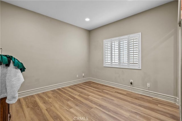 spare room with light hardwood / wood-style floors