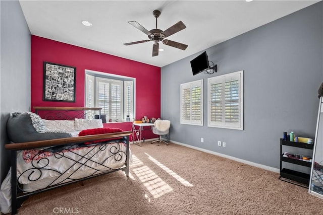 living area with carpet flooring, plenty of natural light, and ceiling fan